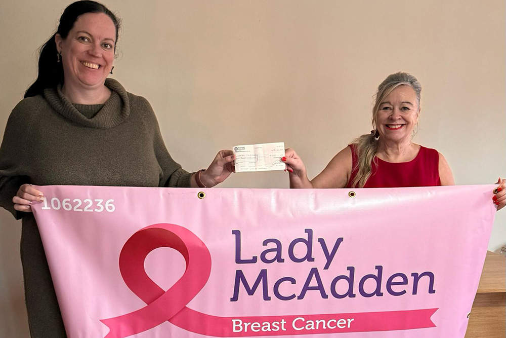 Chrissy Presents Cheque To Lady McAdden Trust